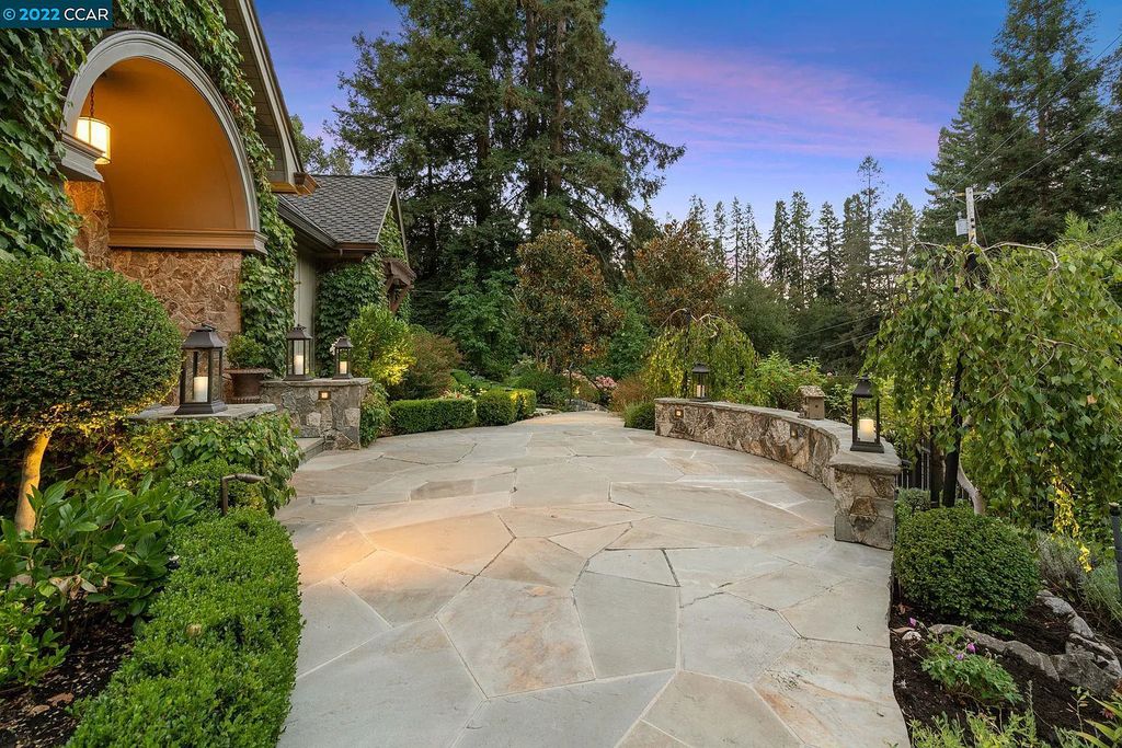 This Happy Valley masterpiece, on a traffic-free cul-de-sac, was built as the personal residence of its noted designer. Outdoor dining areas survey the magnificent terraced garden and adjoin a waterfall feature and firepit.